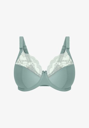 Green bra featuring a smooth fabric base and a lace panel with polka dots and scalloped edges, complemented by adjustable straps.
