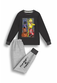 Black sweatshirt with "Five Nights at Freddy's" graphic featuring cartoon characters. Grey sweatpants with black cuffs and text on leg.
