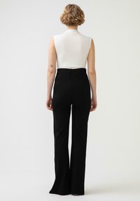 Touché Privé SLIT DETAILED - Hlače - black