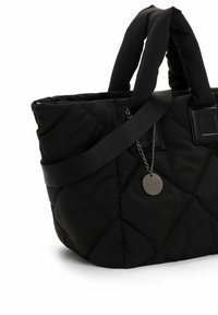 Black quilted tote bag with padded sides, dual fabric handles, and an adjustable shoulder strap. Features a silver hardware charm detail.