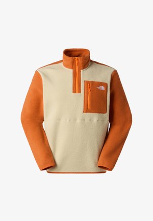 Fleece-Pullover in Creme und Orange mit einem halben Reißverschluss am Kragen, einer Brusttasche mit orangefarbenem Reißverschluss und kontrastierender Ärmelfarbe.