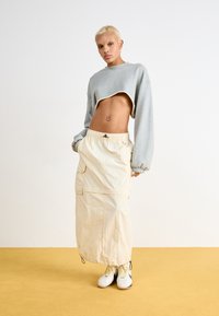 Nike Sportswear DANCE SHRUG - Sweatshirt - dark grey heather/sail