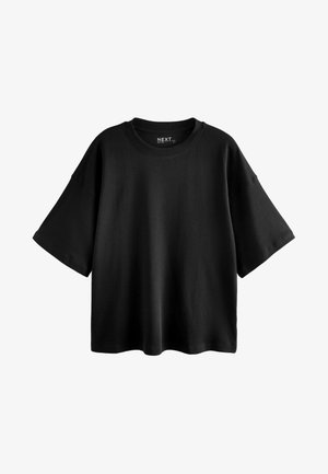 Crna oversized majica kratkih rukava od pamuka s okruglim izrezom i opuštenim krojem. Glatka tekstura s minimalnim šavovima.