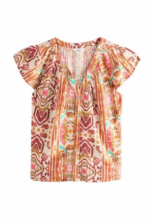 Kortærmet bluse med knapper og V-hals, med flerfarvede abstrakte geometriske mønstre i orange, pink, brun og blågrøn på lyst stof.