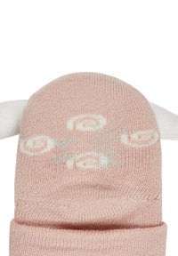 Pink knitted sock with white accents resembling ears, featuring raised white text and a soft texture. The design is rounded and playful.