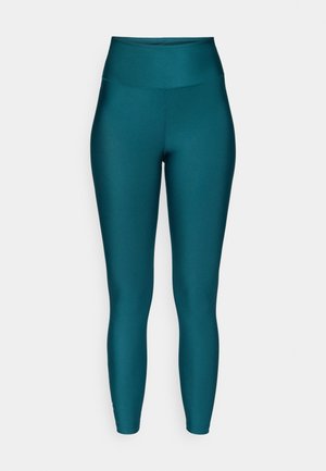 Teal højtaljede leggings lavet af et glat, strækbart materiale. Har et sømløst design og tætsiddende, tapered ben.