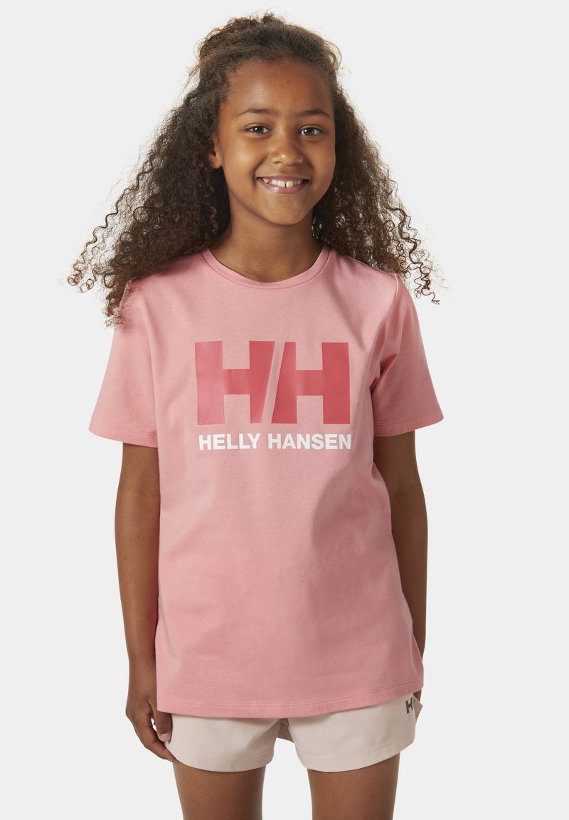 Camiseta de algodón rosa claro con mangas cortas, que presenta un gran logo "HH" en blanco y rojo y el texto "HELLY HANSEN" en la parte frontal.