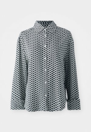 Skjorta med lång ärm i vit och marinblå, med ett geometriskt diamantmönster, krage och knäppning vid ärmsluten. Slät tygkvalitet.