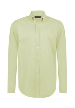Camisa de manga larga verde claro hecha de una tela texturizada, con cuello abotonado y un sutil logo bordado en el pecho.