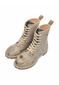Beige lace-up ankle boots with floral patterns, rubber sole, and light brown accents. Features a motivational phrase and decorative elements.