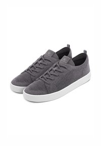 Gray knit sneakers with a textured surface, featuring a white rubber sole, laces, and a logo on the tongue. Soft and breathable material.