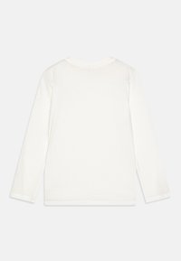 Long-sleeve white t-shirt made of soft fabric, featuring a round neck and straight hem. No visible patterns or embellishments.