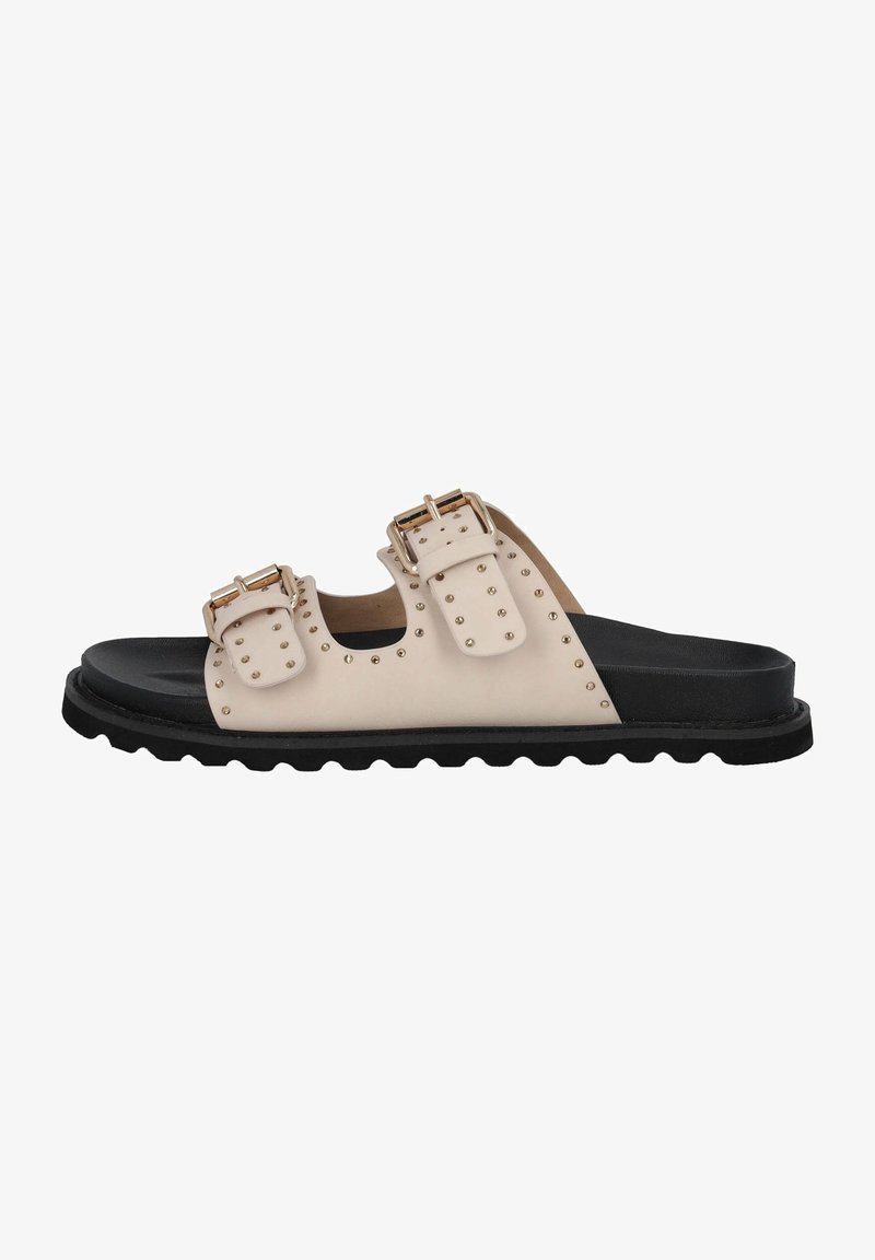 Sandale à glissière beige avec semelle noire, deux brides avec boucles réglables et petits clous en métal le long des brides et des bords.