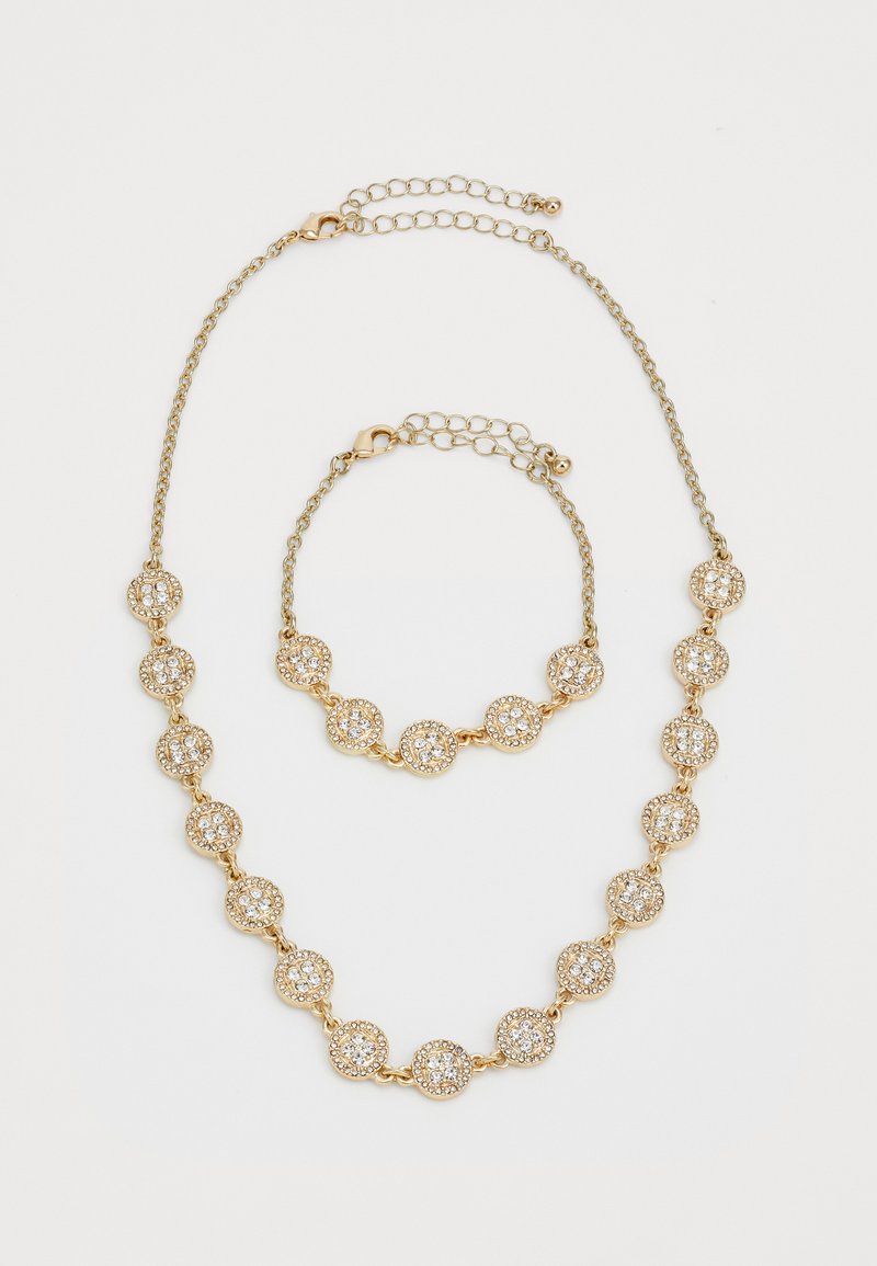 Gold-tone necklace and bracelet featuring round, crystal-encrusted charms linked by delicate chains with adjustable clasps.