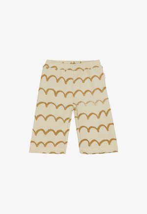 Beige Shorts mit elastischem Bund und weitem Bein, dekoriert mit horizontalen, wellenförmigen braunen Linien im gesamten Design.