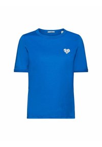 T-shirt bleu à manches courtes et col rond avec un petit texte en forme de coeur blanc sur le côté gauche de la poitrine disant "Tout ce dont nous avons besoin, c'est d'un ami."