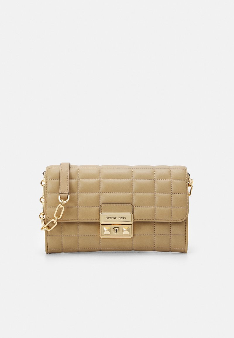 Small beige quilted leather clutch with gold chain strap and rectangular gold clasp engraved with brand name.