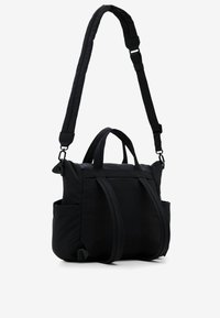 Black nylon handbag with dual top handles and adjustable shoulder strap. Features stitched details and side pockets for added functionality.