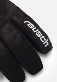 Black gloves with a textured camo pattern, featuring a soft fabric and a white "reusch" logo. The design includes reinforced stitching.