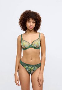 Green lace lingerie set featuring a sheer bra with floral embroidery and matching low-rise brief, accented with delicate hardware details.
