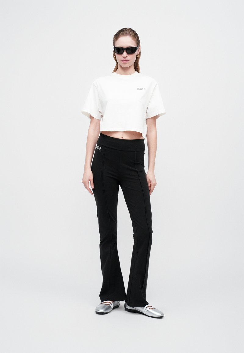 PUMA X ROSÉ SLIM PINTUCK FLARED - Legíny - kalhoty - black