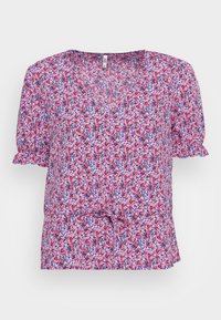 Blusa floral com decote em V, mangas curtas bufantes e detalhe frontal em nó. O tecido apresenta um padrão floral em rosa sobre um fundo azul-marinho.