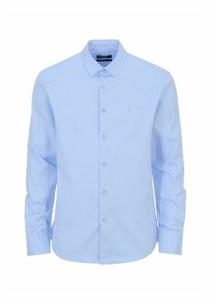 Jasnoniebieska, długotaliowana koszula na guziki z gładkiego materiału. Posiada klasyczny kołnierzyk oraz zapięcie na guziki z małym logo.