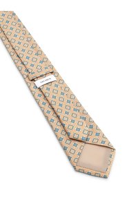 Γραβάτα με σχέδια σε μπεζ απόχρωση με μπλε και πορτοκαλί μοτίβα. Κατασκευασμένη από ύφασμα, διαθέτει μυτερό άκρο και ετικέτα κοντά στο στενό άκρο.