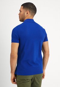 Lacoste Polo majica - captain