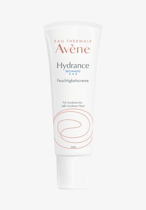 White tube of Avène Hydrance cream with blue and orange text. Features a swirl pattern in orange, capped with a rounded white lid.