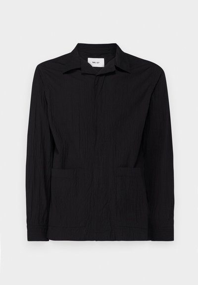 Black textured long-sleeve shirt with a classic collar, front button closure, and two front pockets. Made from lightweight fabric.