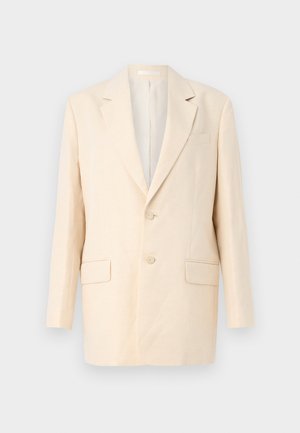 Blazer beige in lino con design a singolo petto, revers a conferenza, due tasche frontali, una tasca sul petto e due bottoni. Tessuto liscio, silhouette rilassata.