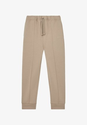 Pantalon de survêtement beige fuselé avec taille élastique, cordon, poignets côtelés et petit logo "REISS" sur la partie supérieure de la cuisse droite.