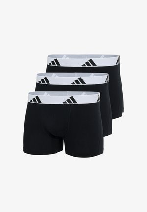 Pack de tres bóxers negros, hechos de algodón suave. Cintura elástica con el logotipo blanco de Adidas y acentos negros. Sin patrones ni texturas.