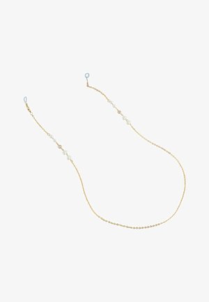 Delikatny złoty łańcuszek z małymi białymi perłami rozmieszczonymi na całej jego długości oraz przezroczystymi oczkami na obu końcach do mocowania.
