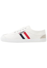 White canvas sneaker with red and navy stripes, round toe, lace-up front, and textured white rubber sole. Grey accent at the heel.