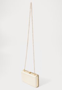 Metallic gold clutch bag with a rigid rectangular shape, featuring a chain strap and textured border detailing along the edges.