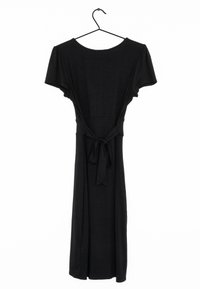 Black dress with short sleeves, made of soft fabric, featuring a tie at the waist and a flowy skirt, hanging on a black metal hook.