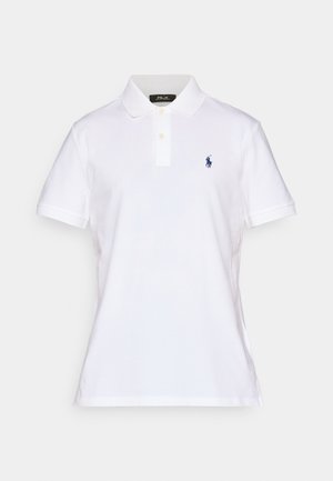 White polo shirt made of cotton, featuring a classic collar, two button placket, and a small blue embroidered logo on the chest.
