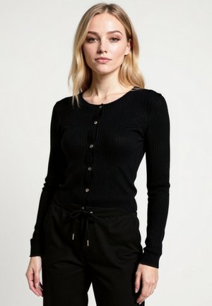 Cardigan nero a coste con scollo rotondo, chiusura a otto bottoni e maniche lunghe. Presenta una silhouette aderente e una texture sottile.