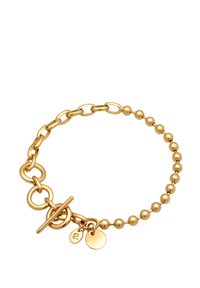 Guldring som har en kombination av stora länkar och små rundade pärlor, med en toggle-lås och två extra cirkulära berlocker.