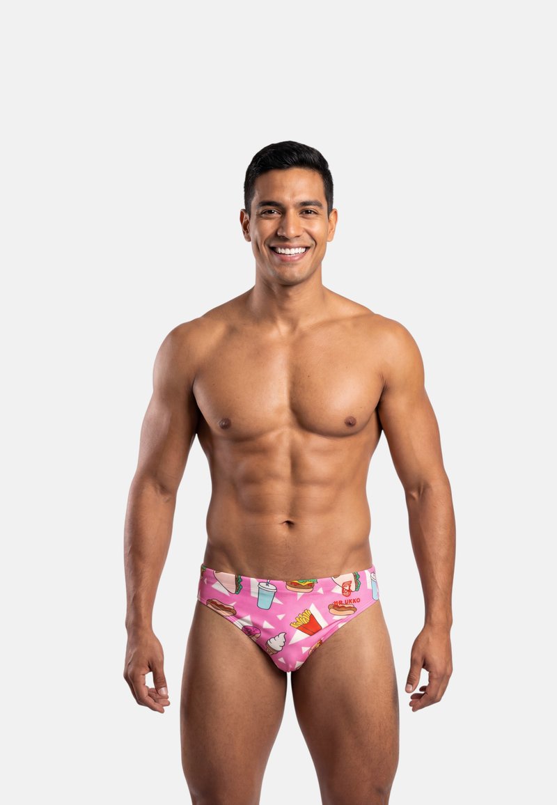 Lyserøde badebukser med legesyge madtema-mønstre, herunder is, hotdogs og drikkevarer. Fremstillet af elastisk, behageligt materiale.