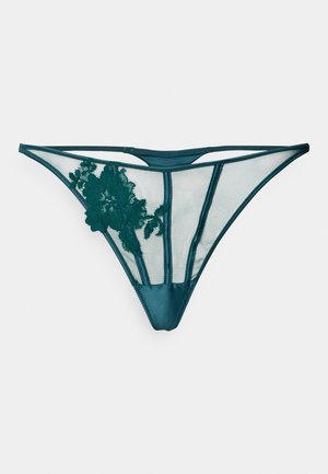 String en dentelle et mesh teal avec des côtés transparents, ceinture en satin, motif floral d'un côté et dos en forme triangulaire.