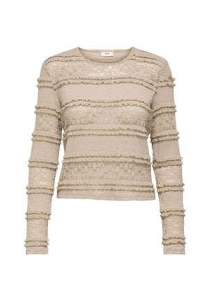 Haut en dentelle beige à manches longues avec des détails de finition en volants horizontaux et un col rond.