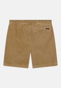 Vaaleanruskeat corduroy-shortsit, joissa on teksturoidun kuvioitu pinta. Varustettu joustovyöllä ja pienellä takataskulla, jossa on brändilogo.