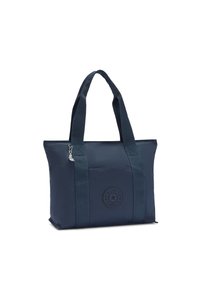 Sac fourre-tout bleu marine en tissu résistant, doté de deux bretelles, d'une poche avant et d'un écusson rond avec logo. Fermeture éclair en haut.