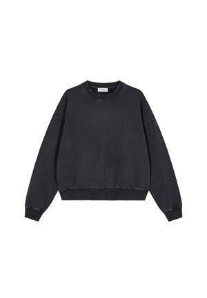 Bomullsgenser med rund hals i svart, med en avslappet passform, senkede skuldre, ribbestrikkede ermer og kant, med en glatt tekstur og minimalistisk design.