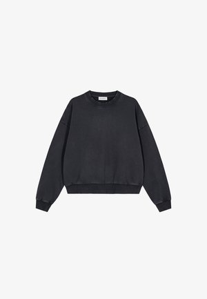 Bomullsgenser med rund hals i svart, med en avslappet passform, senkede skuldre, ribbestrikkede ermer og kant, med en glatt tekstur og minimalistisk design.