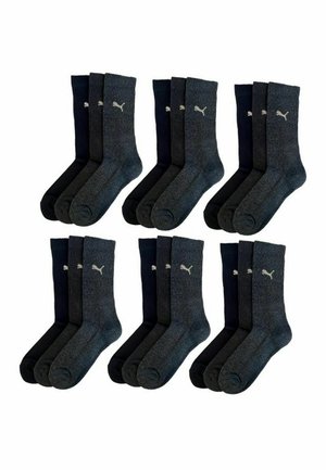 Vier Paar gerippte Socken in Dunkelgrau und Marineblau, mit einem kleinen weißen Logo auf jeder Socke, aus einem weichen, strukturierten Material gefertigt.