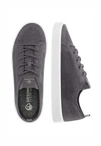 Gray textile sneakers with a mesh upper, flat white sole, round toe, and six eyelets for laces. Branding on tongue and insole.